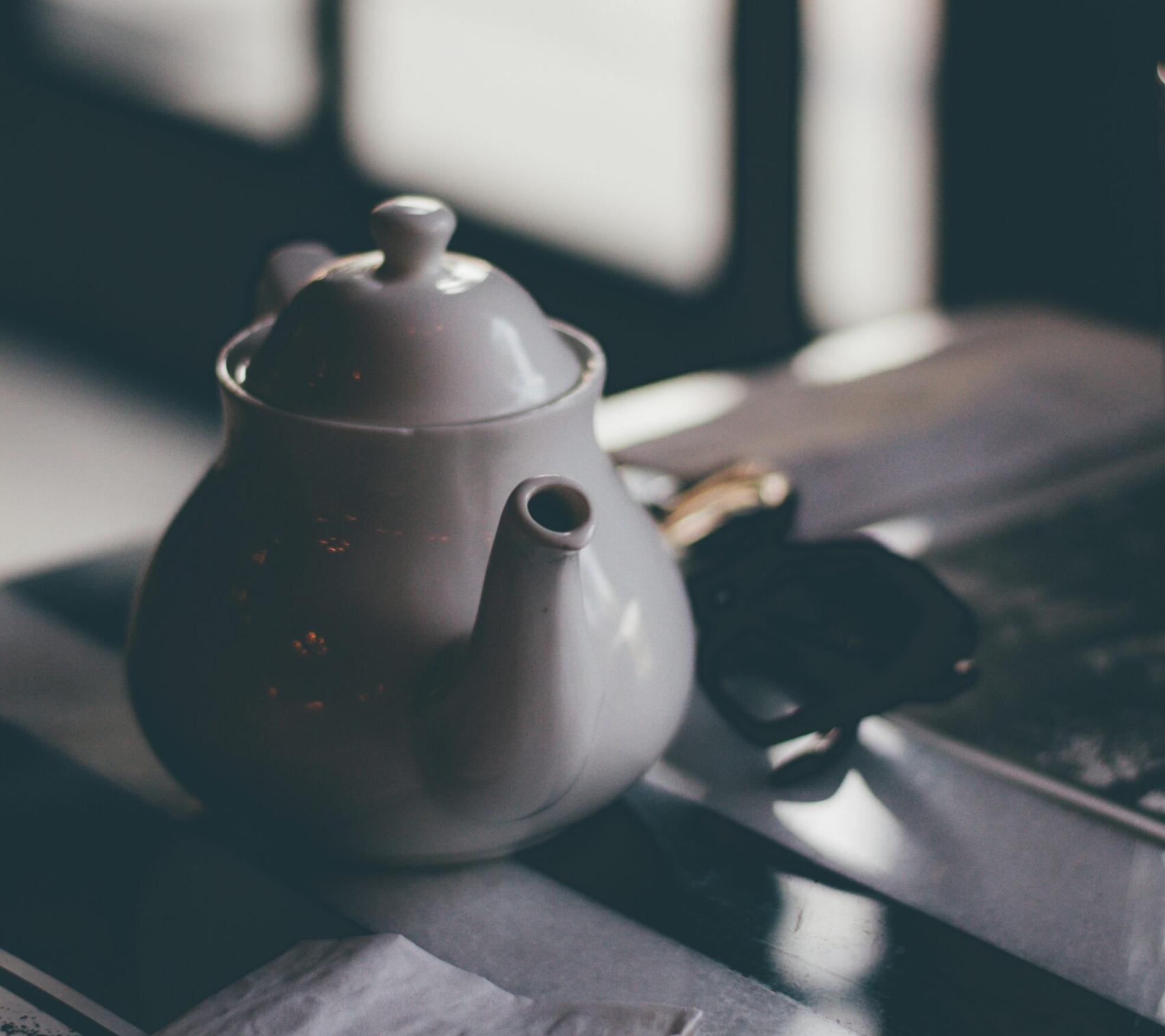 white ceramic teapot on table